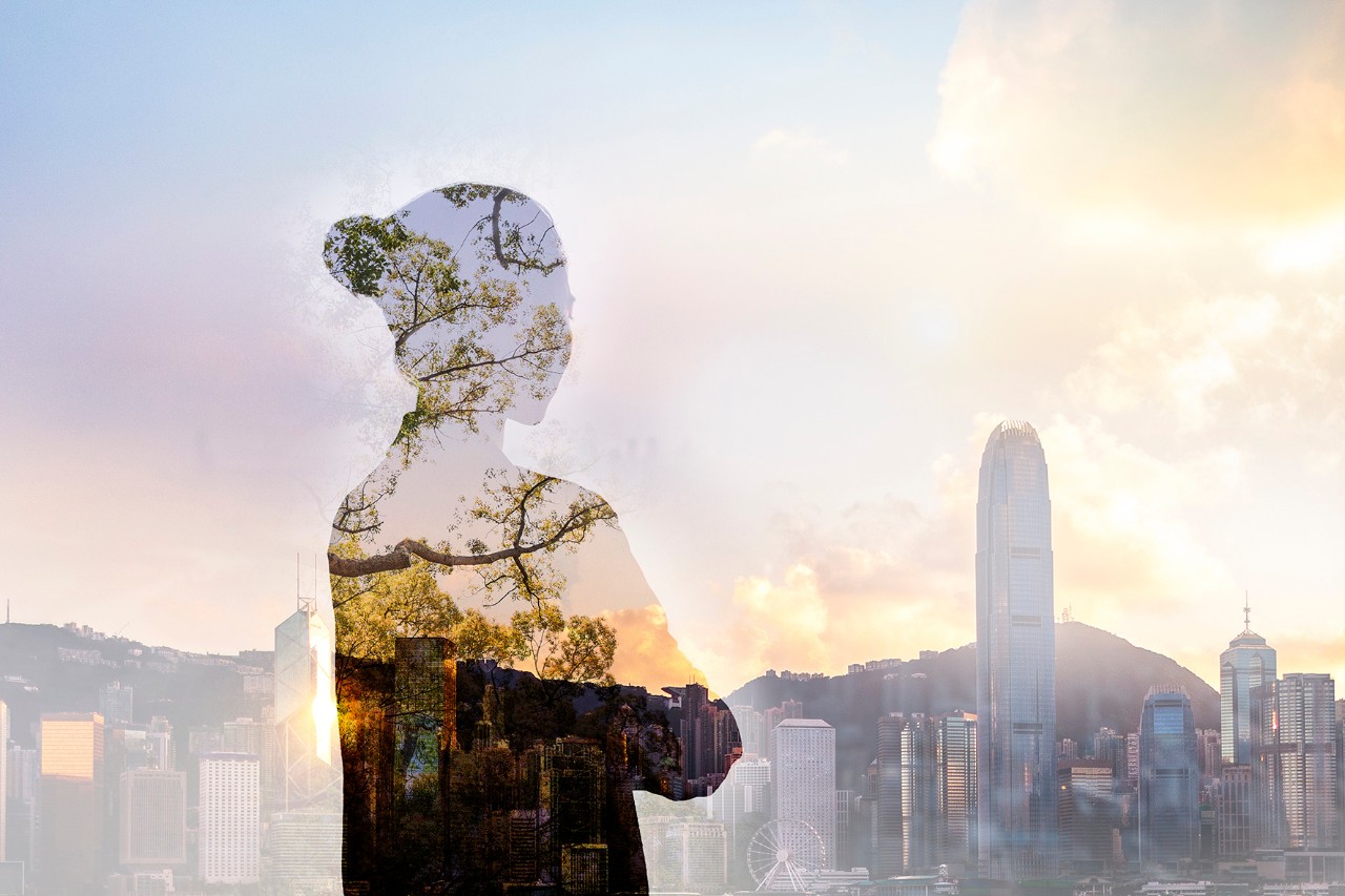 A woman's transparent shadow over a city in the background
