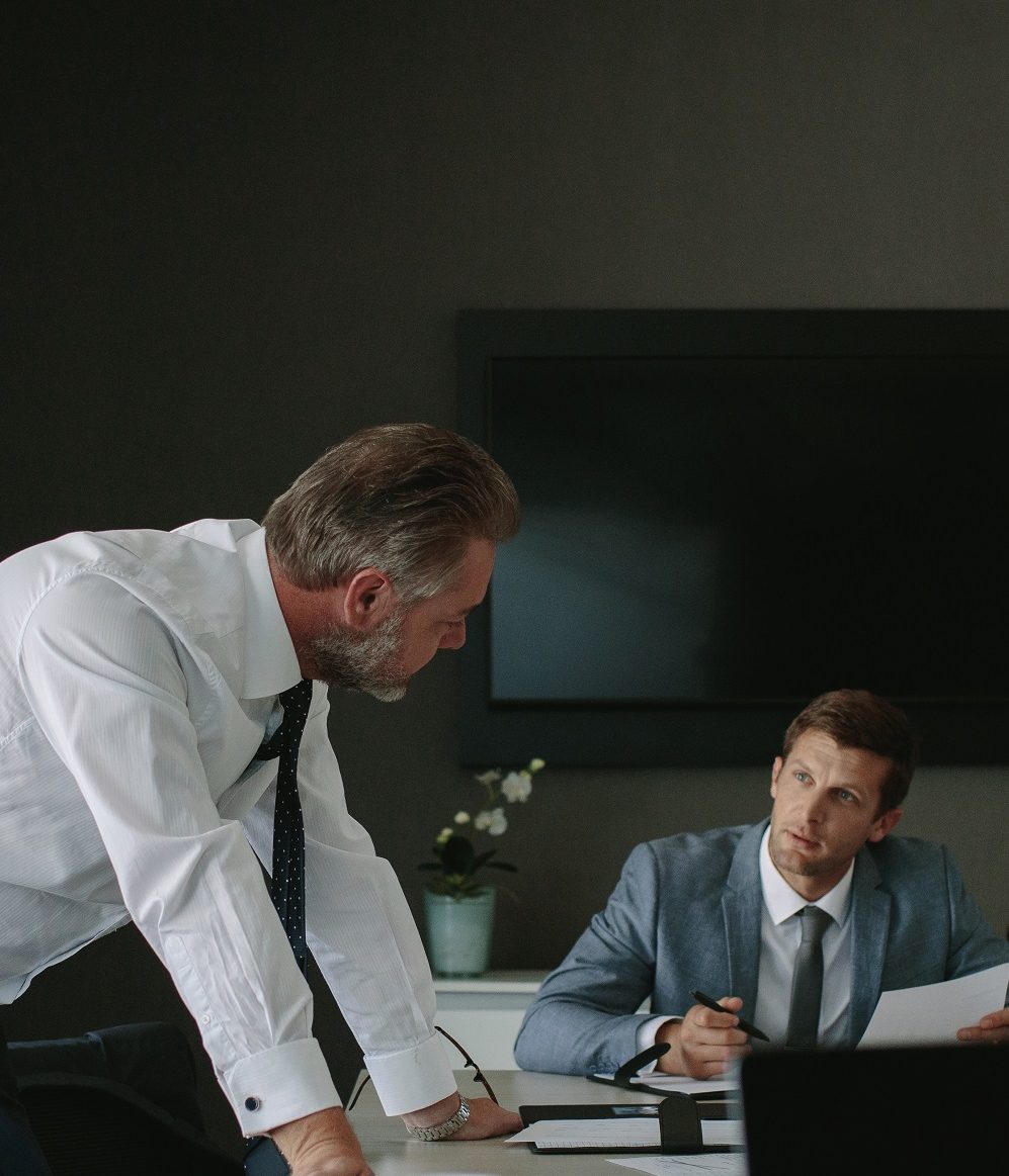 Group of coworkers during a meeting in an office. Corporate professionals having a discussion at meeting in conference room.